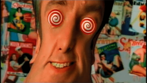 Man with spiral hypnotic twirls in his eyes portrays a style