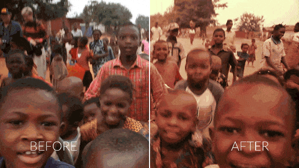 African children excitedly looking at a camera.