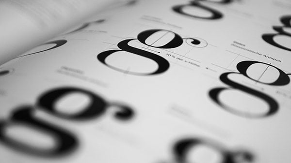 Close up of a font book for top 10 free movie fonts.